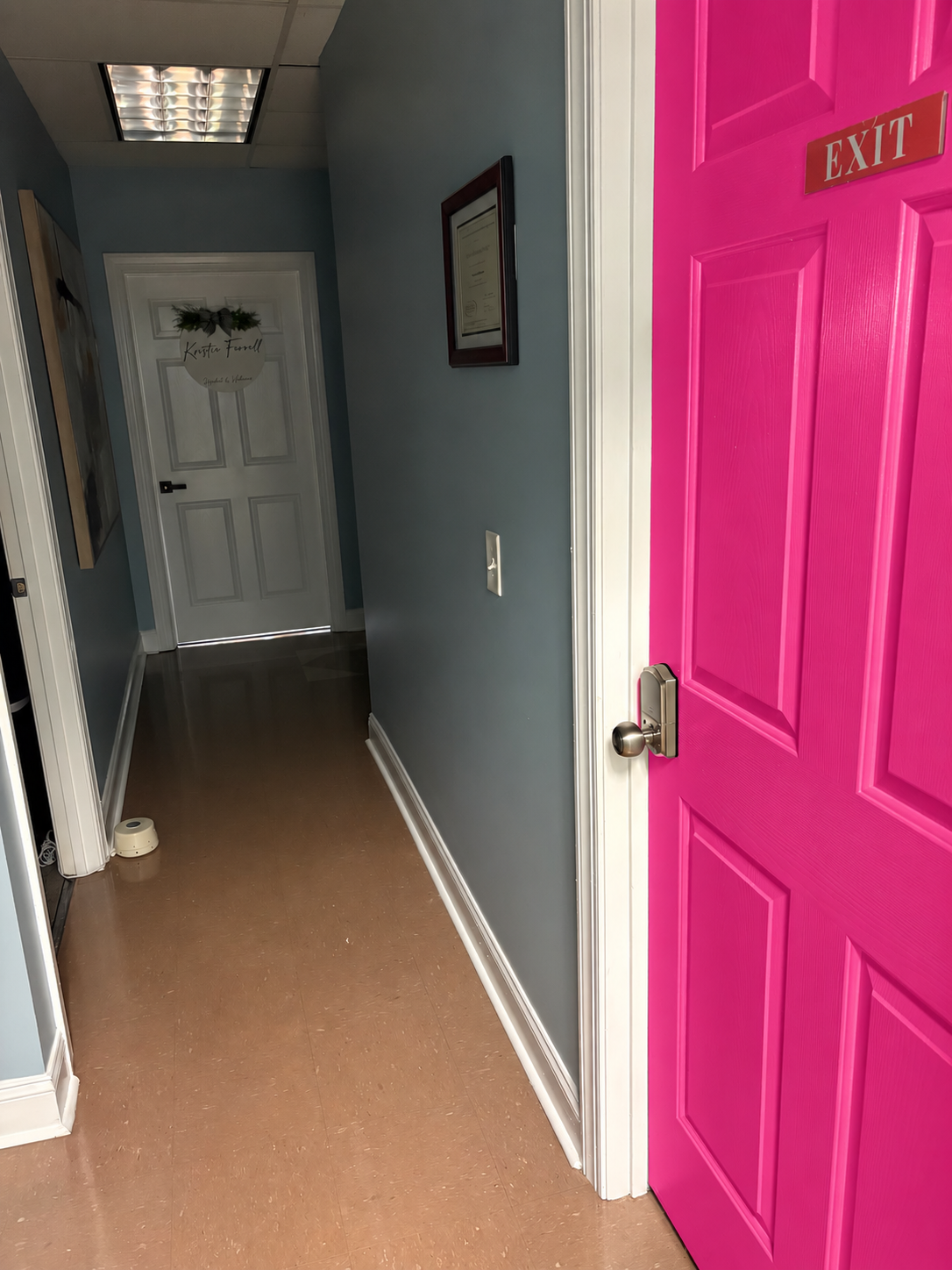 Hot pink hallway door mockup at Hushed and Unheard Medical & Wellness
